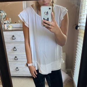 Large ruffled white blouse with zipper detailing